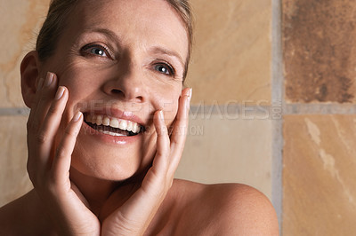 Buy stock photo Bathroom, mature or happy woman with skincare, beauty or face cosmetics for treatment or confidence. Thinking, tile or proud smile of a senior lady with natural glow, satisfaction or wellness in home