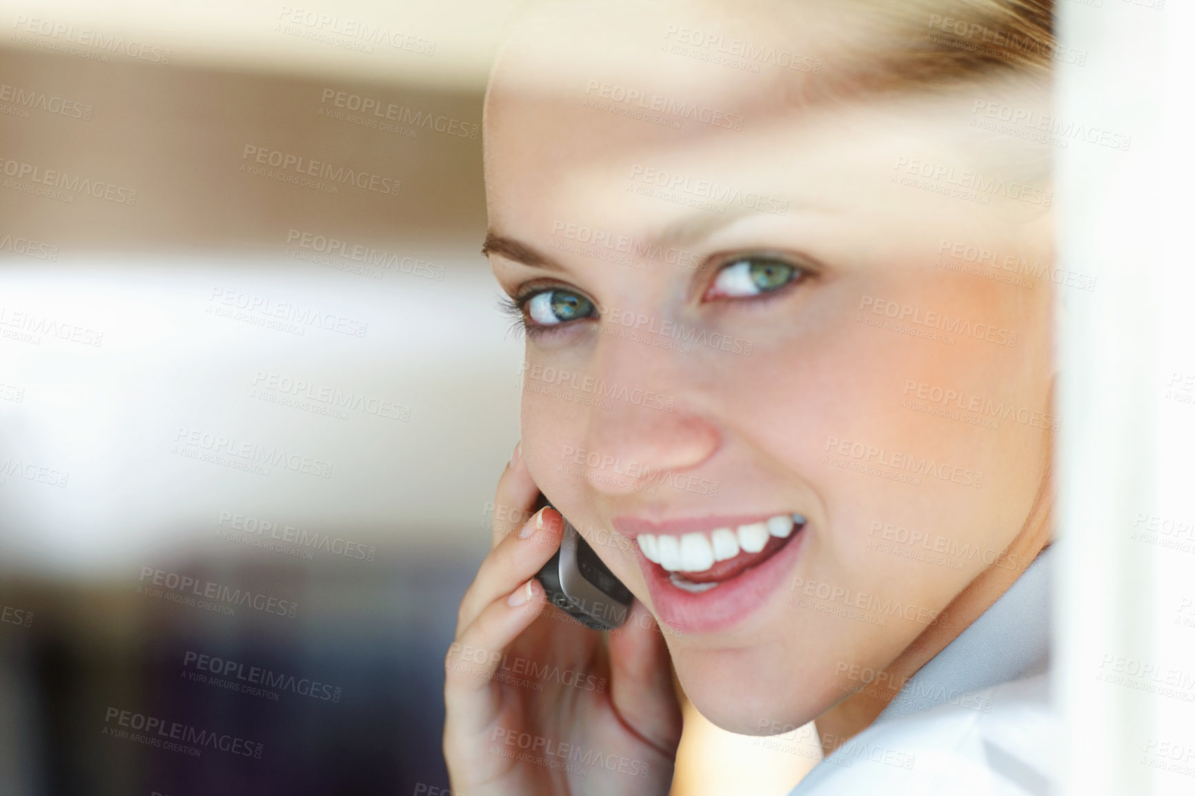 Buy stock photo Closeup of a cute young woman speaking over the cellphone