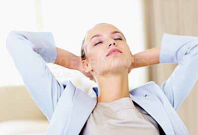 Buy stock photo Successful relaxed business woman with hands behind head at the office