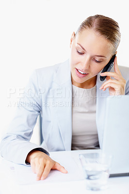 Buy stock photo Happy young business woman reading out a document over the phone