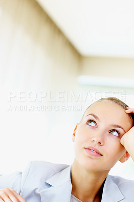 Buy stock photo Cute young business woman looking upwards at copyspace in a thought