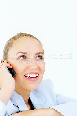 Buy stock photo Closeup of a happy business woman speaking over the cellphone and looking at copyspace