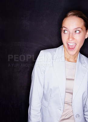 Buy stock photo Young business woman with mouth open isolated against black background