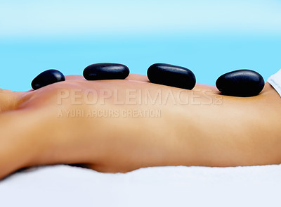 Buy stock photo Spa, woman back and hot stone massage outdoor for wellness, healing and stress relief body treatment zoom. Luxury, zen and female person at beauty resort for rock therapy, pamper or peace in Thailand