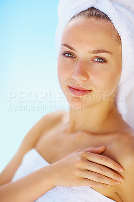 Buy stock photo Portrait, woman and spa towel outdoor with wellness, skincare and health treatment with blue sky. Peace, rest and zen of a calm female person on vacation with body care and ready for resort massage