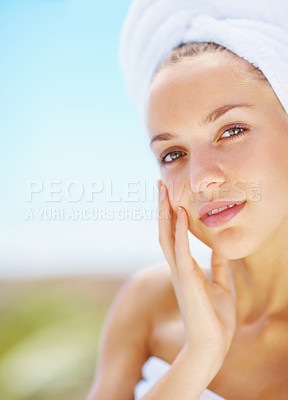 Buy stock photo Woman, spa and outdoor with skincare, portrait or hands with face for results with blue sky background. Girl, touch skin and facial change with beauty, cosmetic transformation and wellness in nature