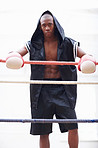 Boxer in black hooded robe