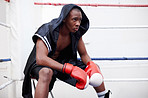 Boxer sitting in ring
