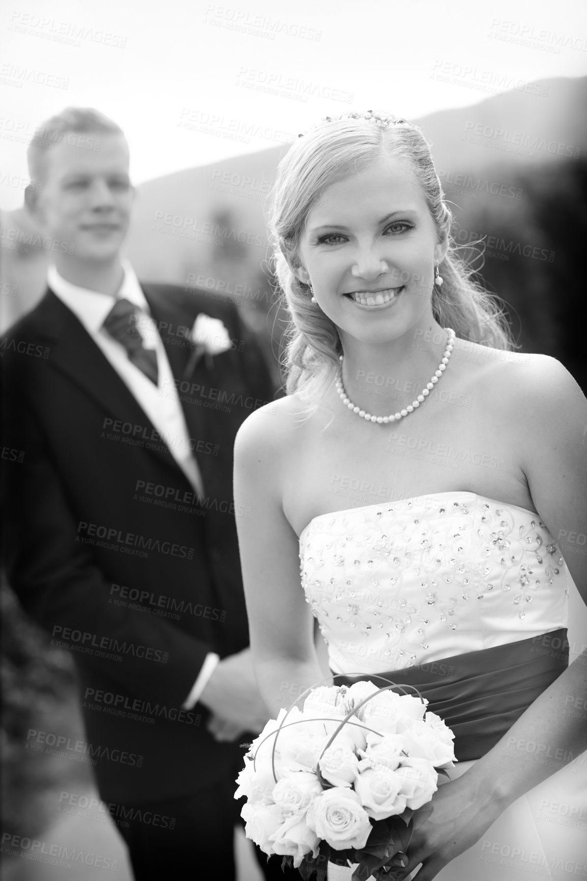 Buy stock photo Shot of a bride and groom on their wedding day in grayscale