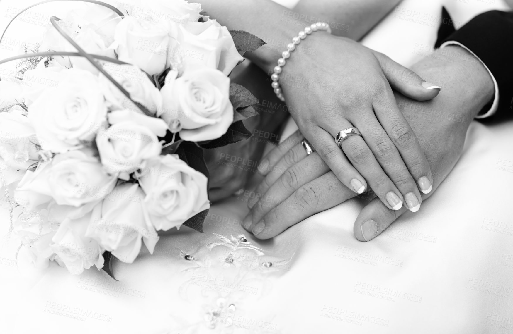 Buy stock photo Closeup shot of a couple's hands on their wedding day in grayscale