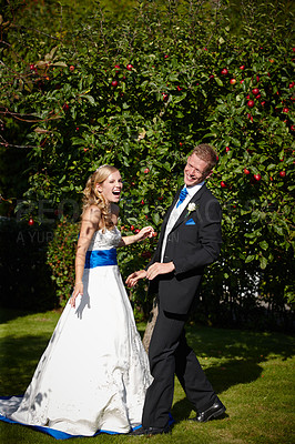 Buy stock photo Full length shot of a bride and groom on their wedding day