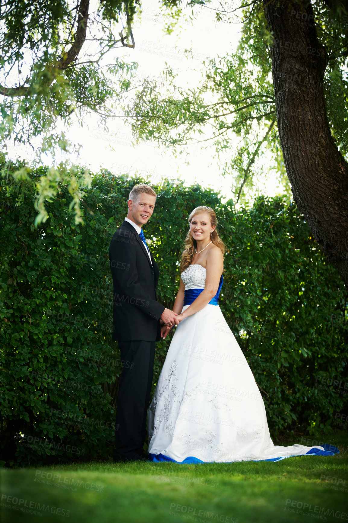 Buy stock photo Full length shot of a bride and groom on their wedding day