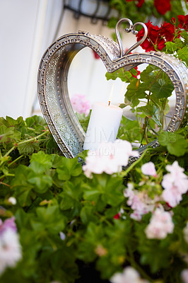 Buy stock photo Shot of a candle in a heart shaped ornament 