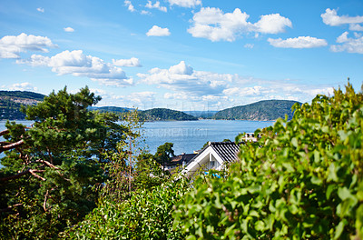 Buy stock photo Cropped shot of a house near a body of water