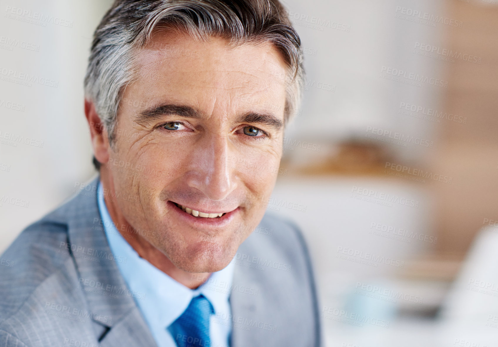 Buy stock photo Portrait of a confident-looking mature businessman