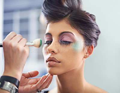 Buy stock photo A young woman with cosmetic enhancements having makeup applied
