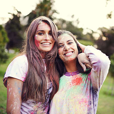 Buy stock photo Color, festival and portrait of women with powder together for fun, Holi and outdoor social in spring, nature and joy. Smile, paint splash and celebration in park with friends, trees and happy event 