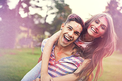 Buy stock photo Happy, powder paint and couple of friends hug at Holi festival and colorful event with smile. Celebration, love and excited in nature with hipster people and crazy color dust for party together