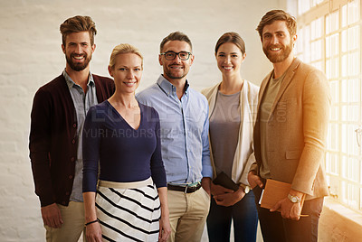 Buy stock photo Cropped portrait of a business team standing in their office