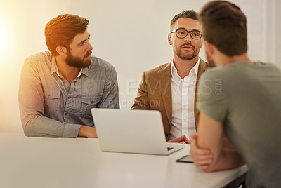 Buy stock photo Cropped shot of three businessmen in the boardroom