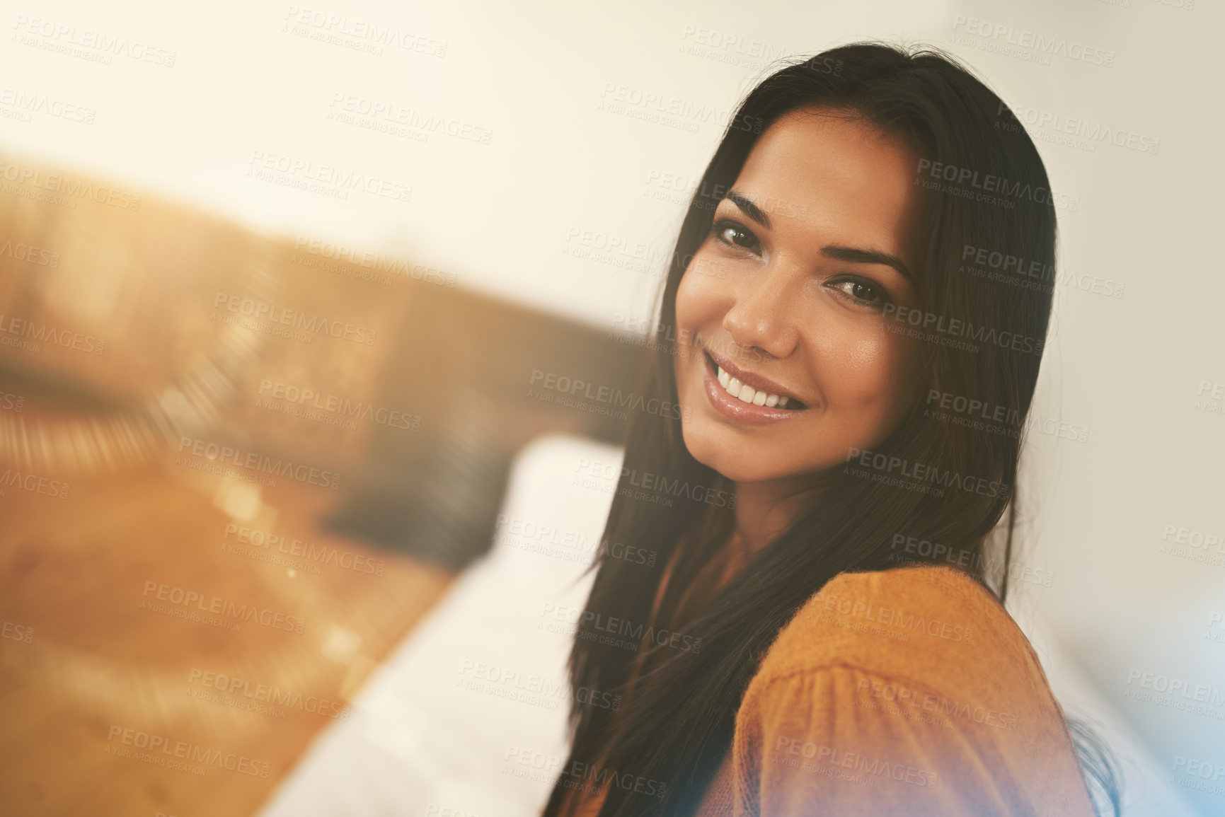 Buy stock photo Living room, portrait and woman with smile on couch to relax in home with lens flare in morning. Girl, female person and happiness for break on weekend to rest on sofa in lounge of apartment