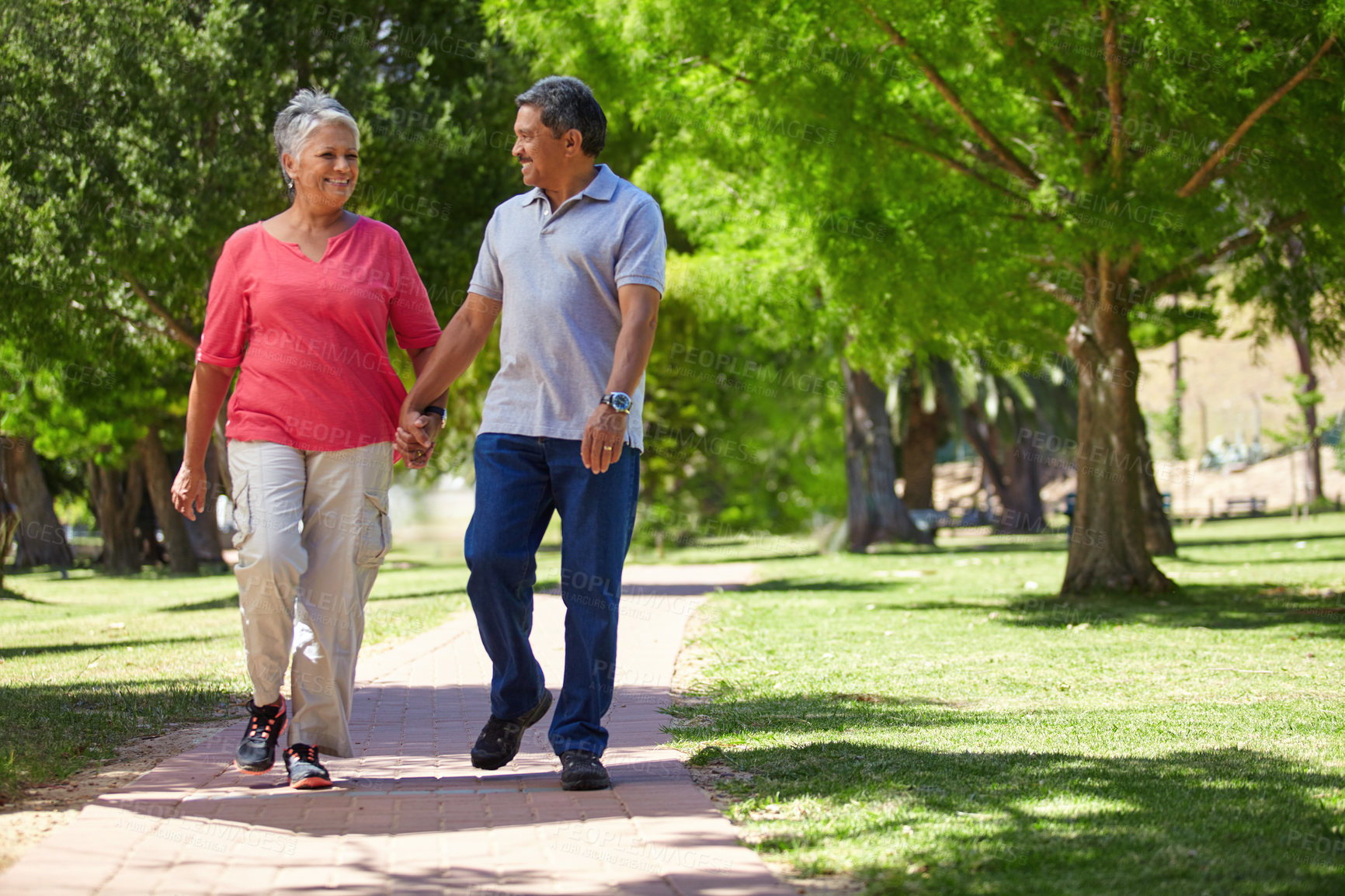 Buy stock photo Shot of a loving senior couple enjoying quality time together outdoors