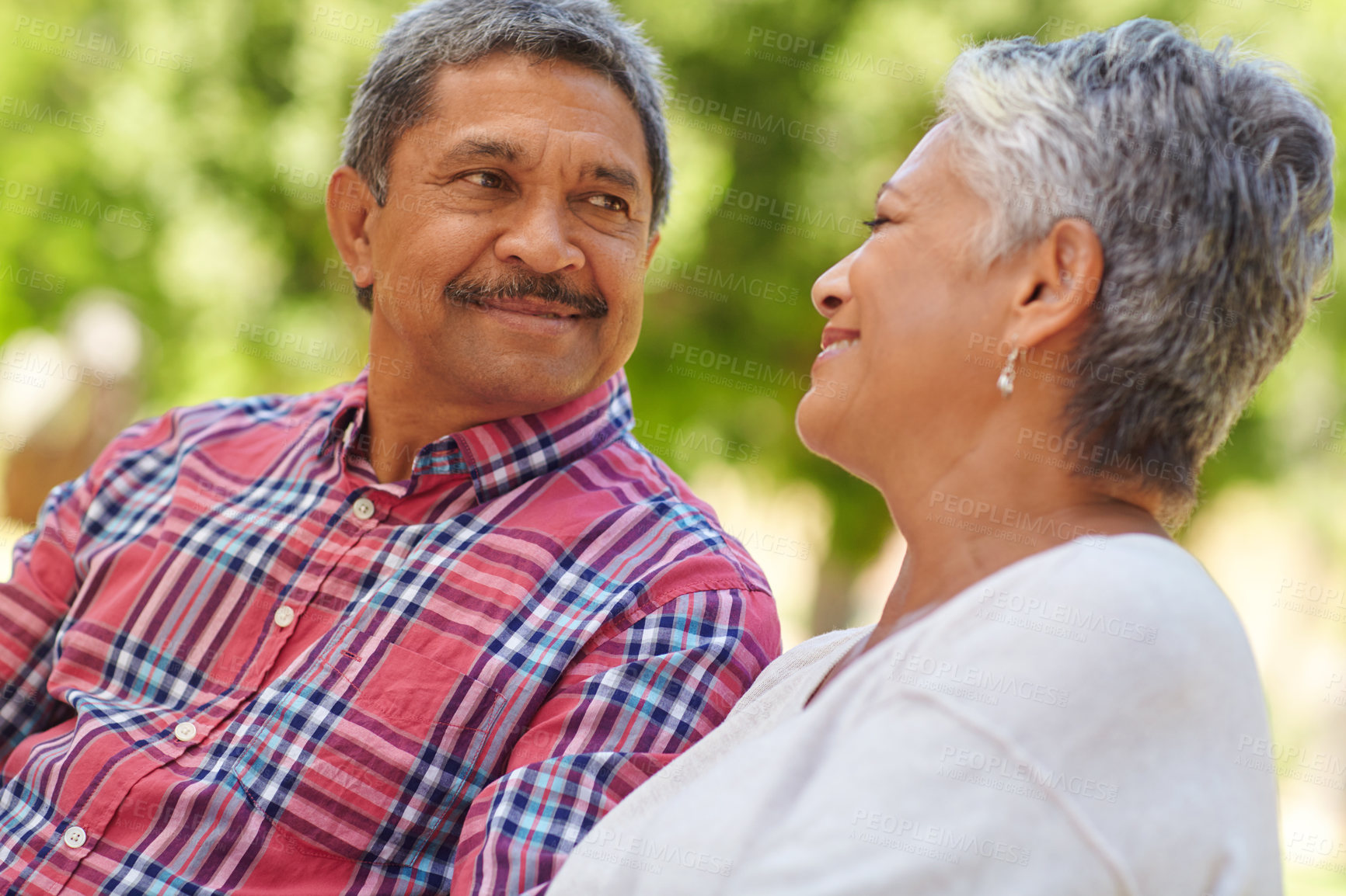 Buy stock photo Shot of a loving senior couple enjoying quality time together outdoors