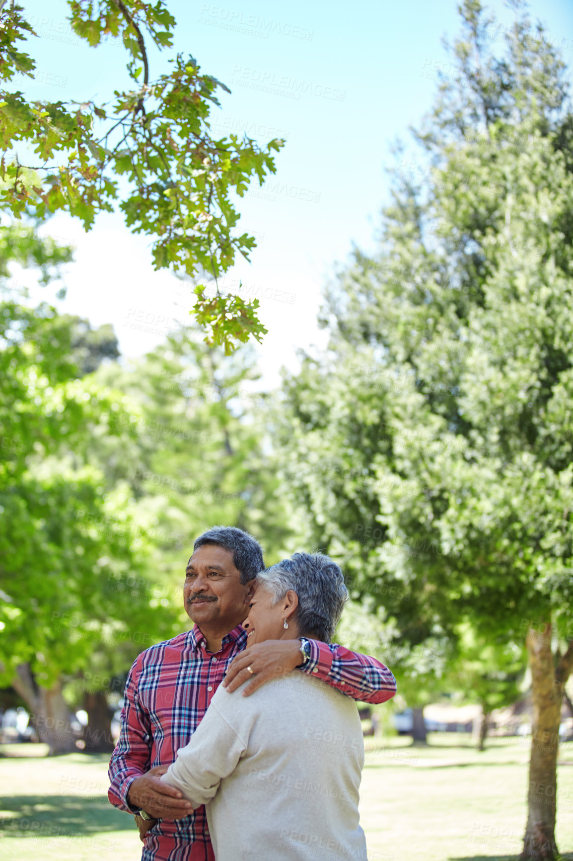 Buy stock photo Shot of a loving senior couple enjoying quality time together outdoors