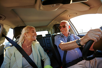 Buy stock photo Shot of a senior couple on a road trip