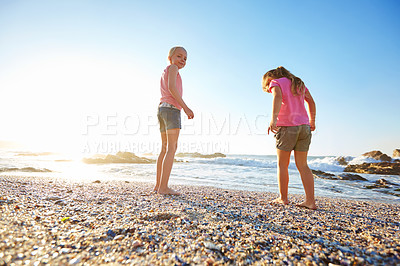 Buy stock photo Shot of two little girls having fun on the beach