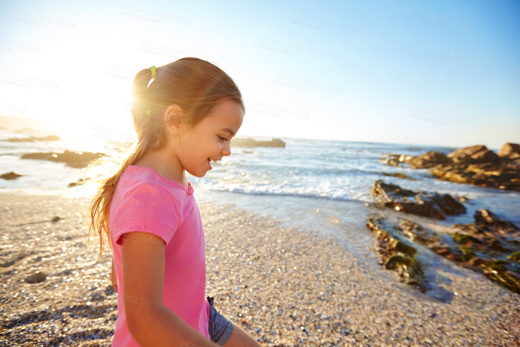 Buy stock photo Shot of an adorable little girl on the beach