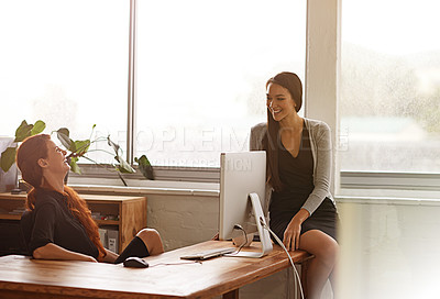 Buy stock photo Talking, friends and business women in office in conversation, chatting and laugh at desk. Communication, collaboration and female workers in casual conversation on break, relax and happy in morning