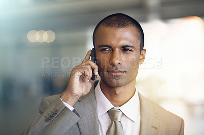 Buy stock photo Cropped shot of a businessman talking on his cellphone