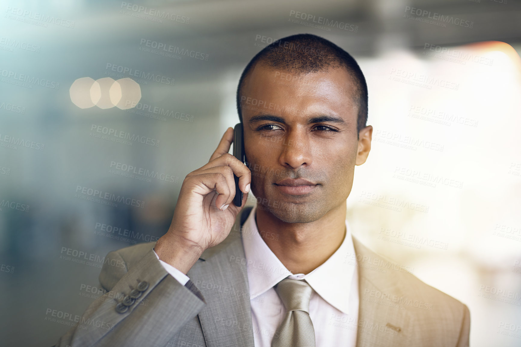 Buy stock photo Cropped shot of a businessman talking on his cellphone