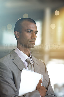 Buy stock photo Cropped shot of a businessman carrying paperwork