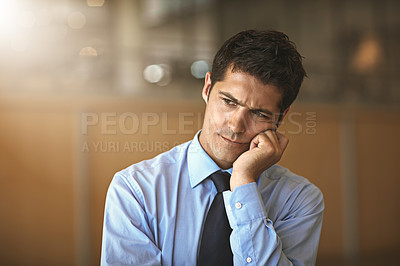 Buy stock photo Cropped shot of a businessman looking stressed in the office