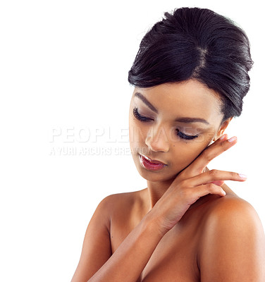 Buy stock photo Studio shot of a young woman touching her perfect skin against a white background
