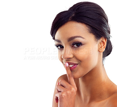 Buy stock photo Studio portrait of a beautiful young woman with her finger on her lips