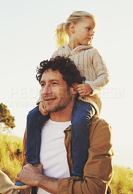 Buy stock photo Nature, sunset and father and child on shoulders for holiday, vacation and adventure outdoors. Happy family, summer and dad carrying young girl for bonding, relationship and fun together on weekend