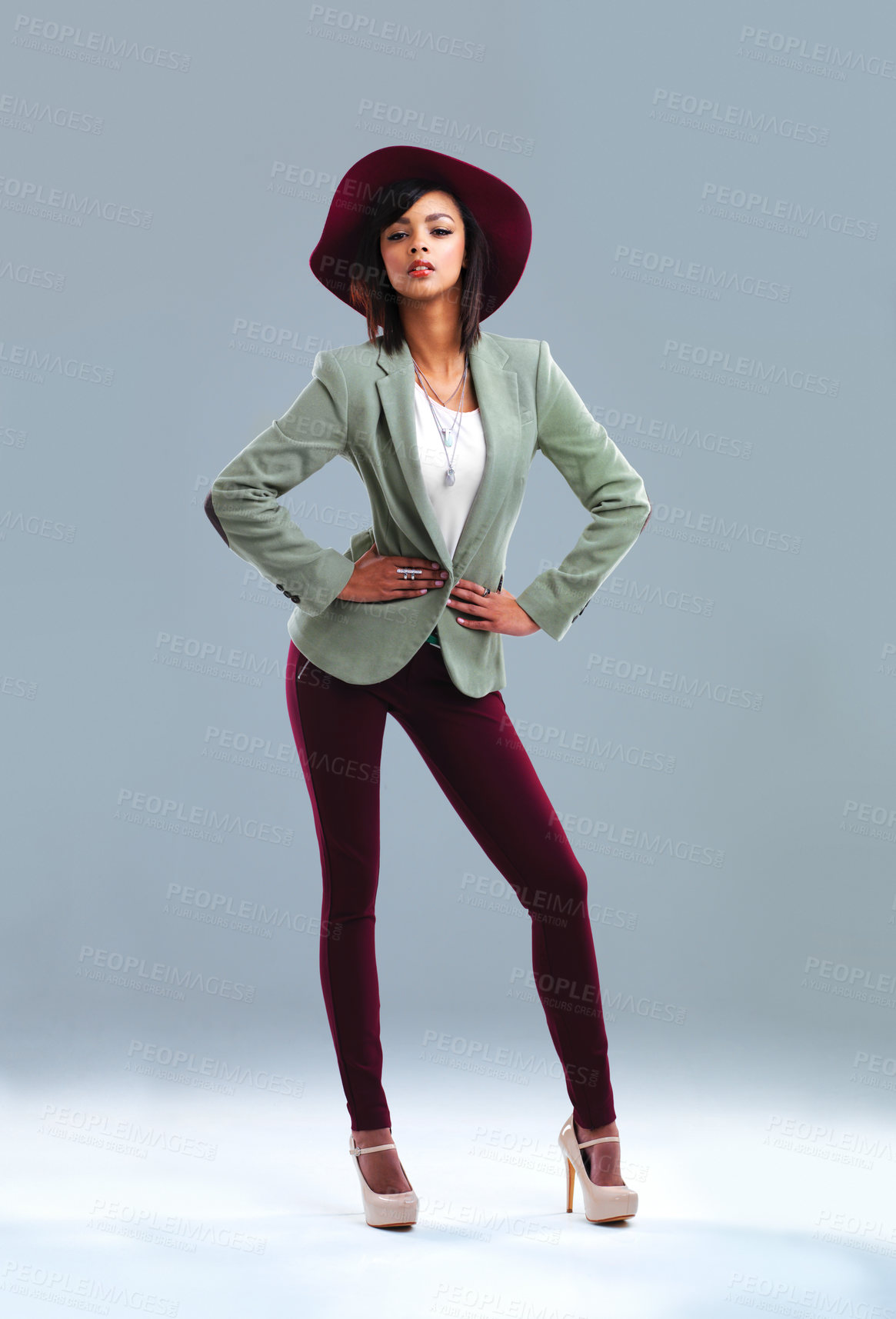 Buy stock photo Full length studio portrait of a stylish young woman posing against a gray background