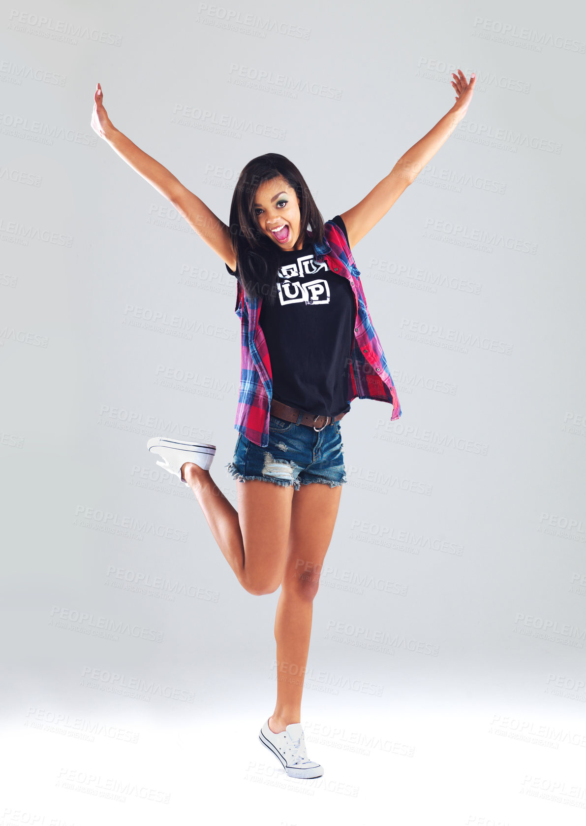 Buy stock photo Full length studio shot of a trendy young woman posing against a gray background