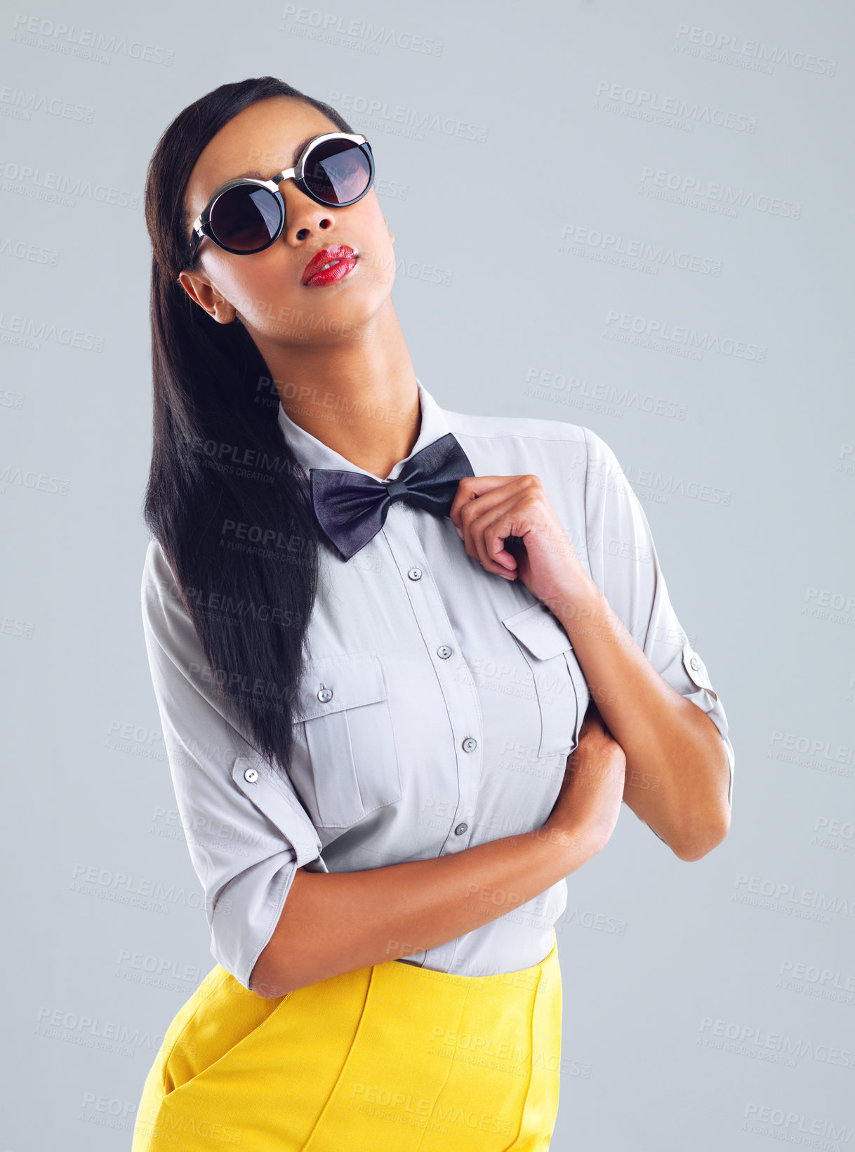 Buy stock photo Fashion, sunglasses and portrait of woman in studio for trendy, quirky or designer eyewear on gray background. Aesthetic, bowtie and gen z model for luxury brand, confident and stylish outfit