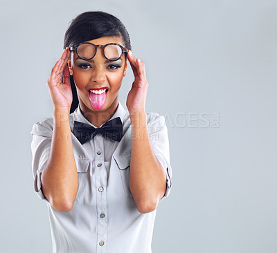 Buy stock photo Funny, girl and emoji face with glasses for fashion in studio for designer, flirting and quirky on backdrop. Gen z, stylish and aesthetic portrait of young woman for crazy, sunglasses, and comedy.