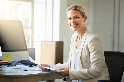 Buy stock photo Portrait of a woman working on paperwork in her office