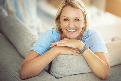 Buy stock photo Portrait of a mature woman relaxing on the sofa at home
