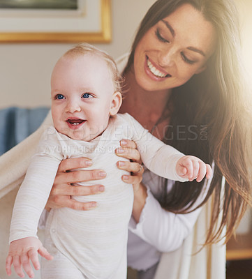 Buy stock photo Family, home and mother playing with baby for bonding, relationship and care for motherhood. Love, parenting and happy mom with newborn infant for child development, support and affection in house