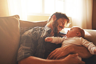 Buy stock photo Father, baby and love on a family home sofa with love, care and support for a child. Happy man or dad with a smile and kid for bonding, development and growth or happiness in relationship with parent