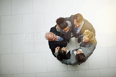 Buy stock photo High angle portrait of a group of businesspeople standing in a huddle