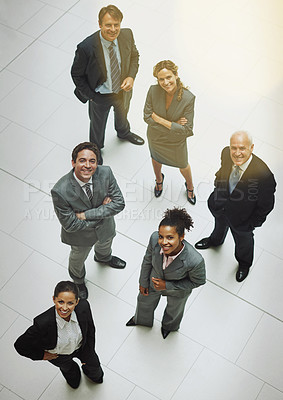 Buy stock photo High angle portrait of a group of businesspeople standing in the office lobby
