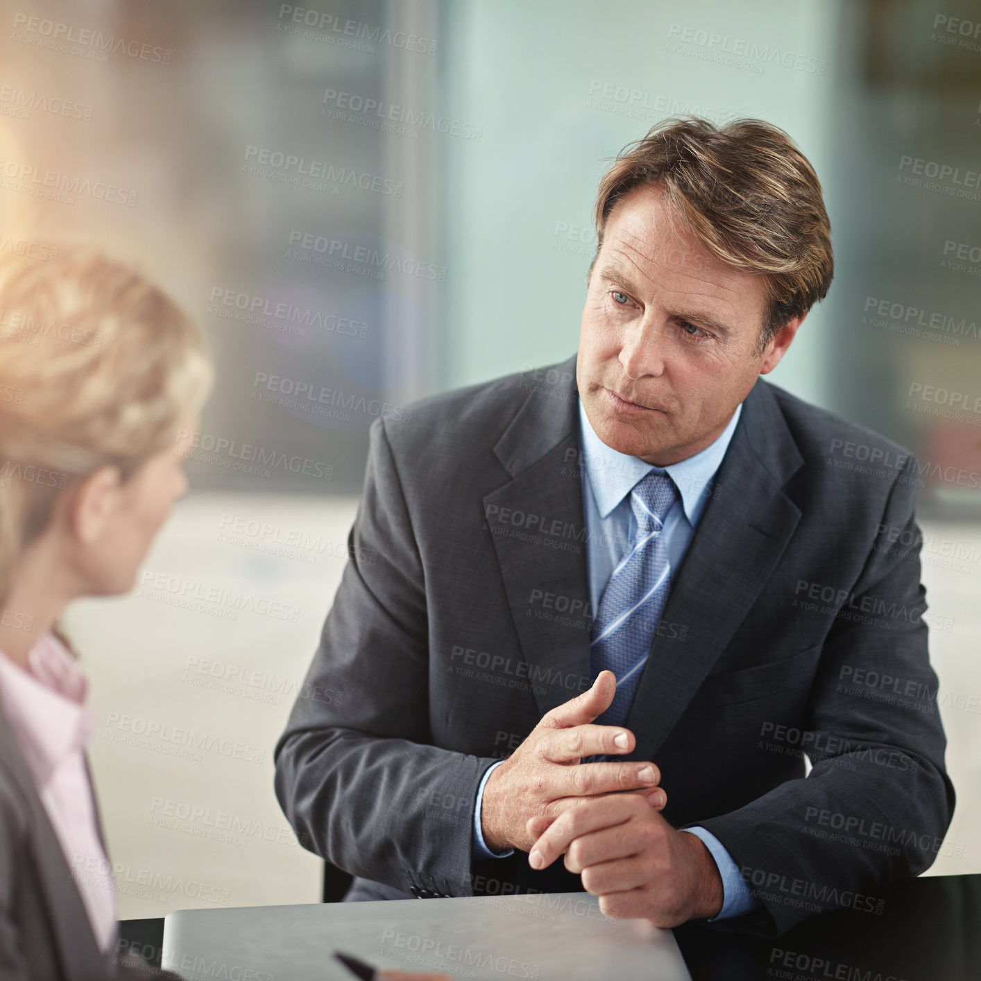 Buy stock photo Cropped shot of two businesspeople in a meeting